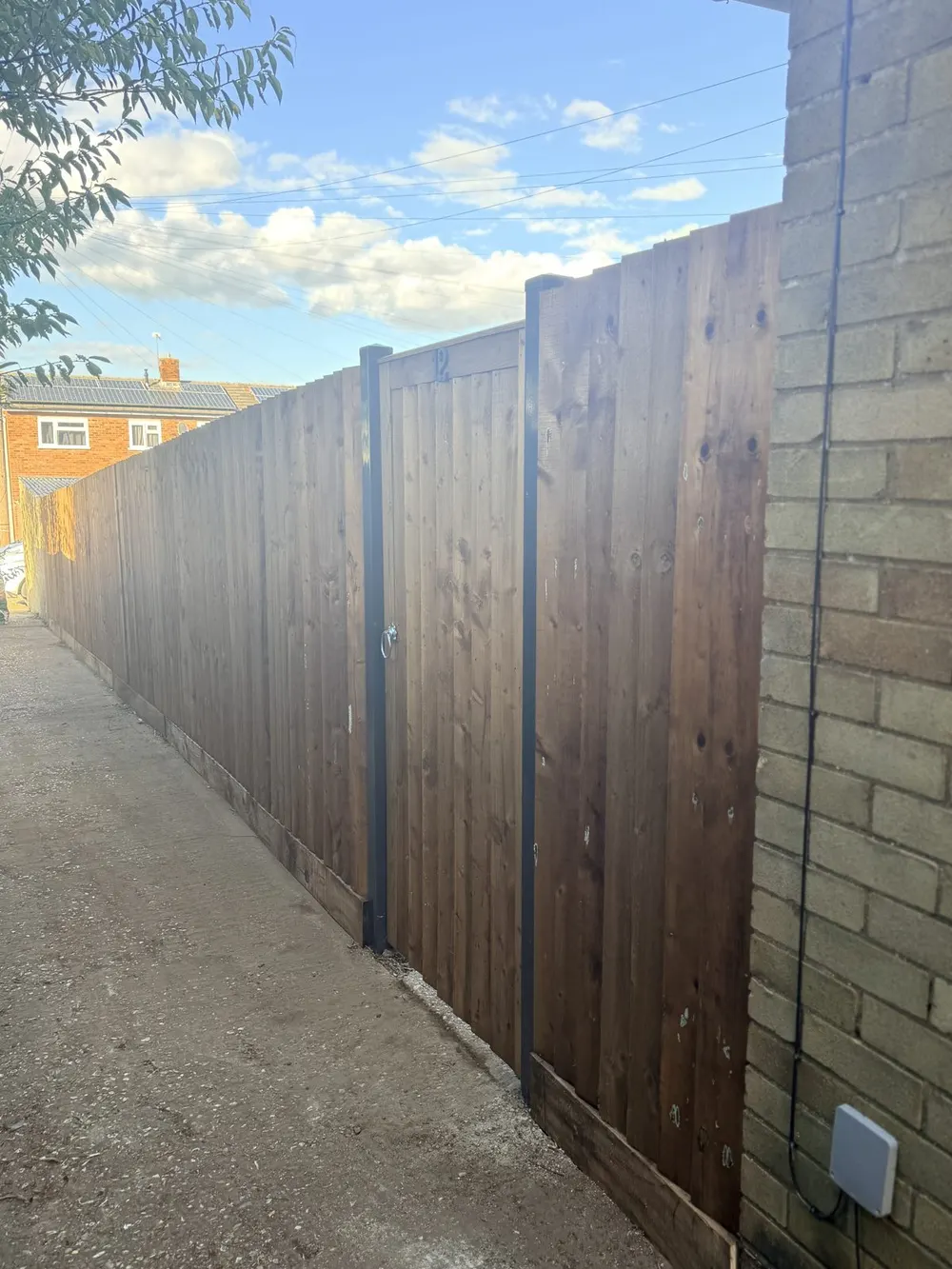 Craig's feather-edge fence with matching timber gate